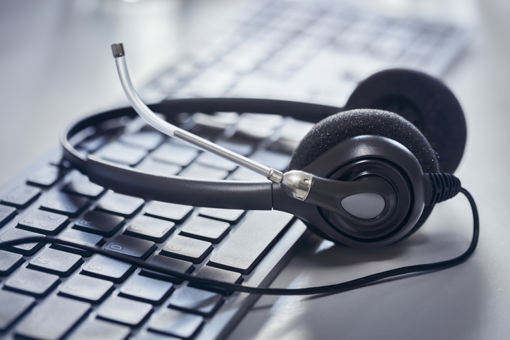 Headset on a desktop computer keyboard background it support services
